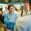event attendees laughing and chatting